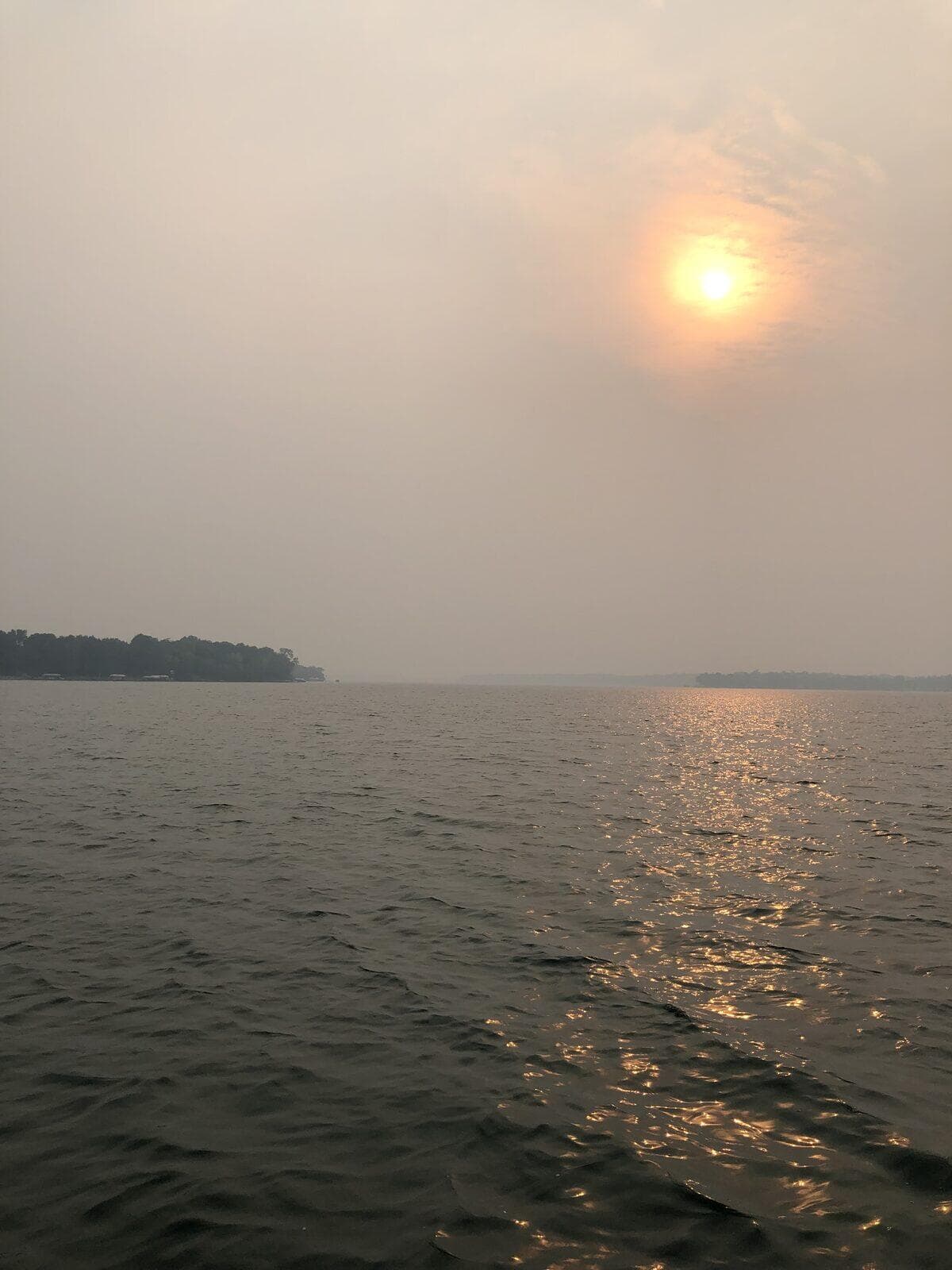 Hazy sunrise mist rising from Pickerel Lake